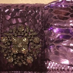 IMAM clutch 👛 with rhinestone center piece.